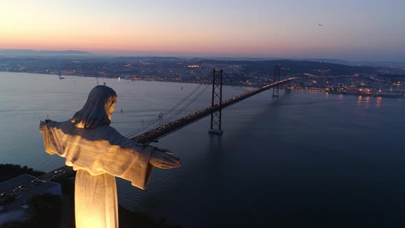 Aerial Footage Lisbon in Twilight and Monument Sanctuary of Christ the King