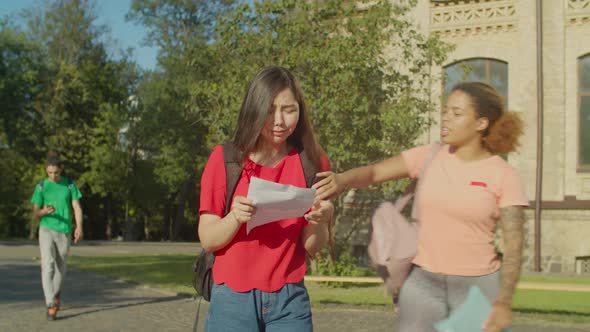 College Students Consoling Friend After Failed Exam alt