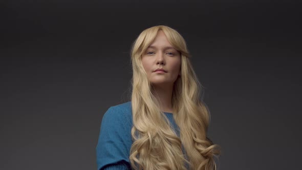 Nordic Blond Model in Studio with Dramatic Top Light alt