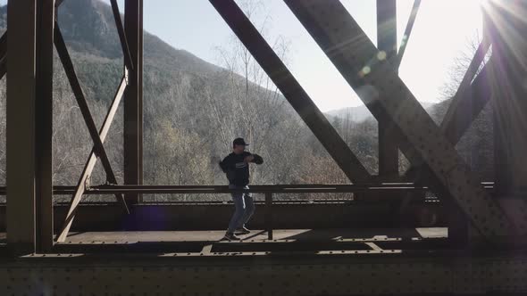 Modern dance on a railway bridge alt