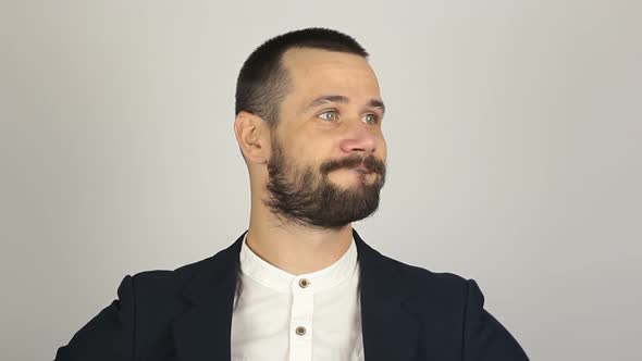 A Young Handsome Businessman Closes His Nose with His Fingers Feeling a Bad Smell alt