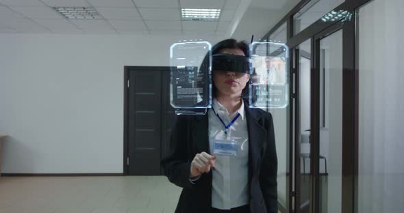 Woman Walking and Using Holographic Technology alt