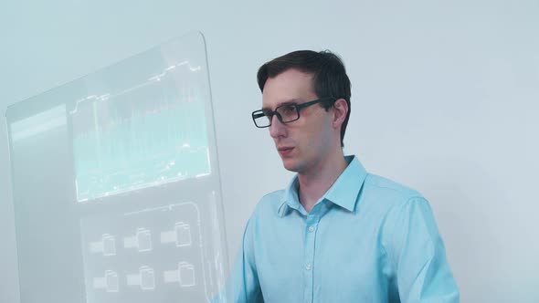 Man Using His High-Tech Computer with Transparent Display alt