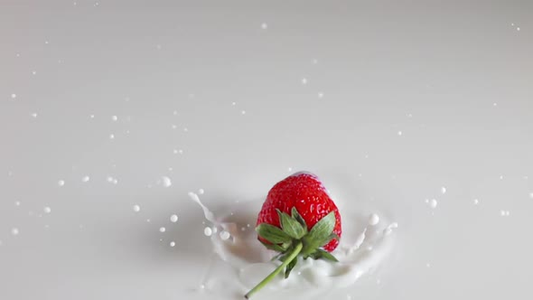Strawberry Falls Into Milk