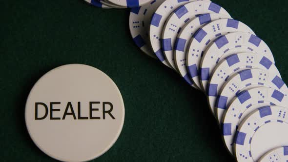 Rotating shot of poker cards and poker chips on a green felt surface - POKER 055 alt