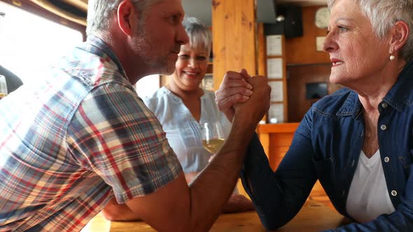 Friends playing arm wrestling with each other 4k alt