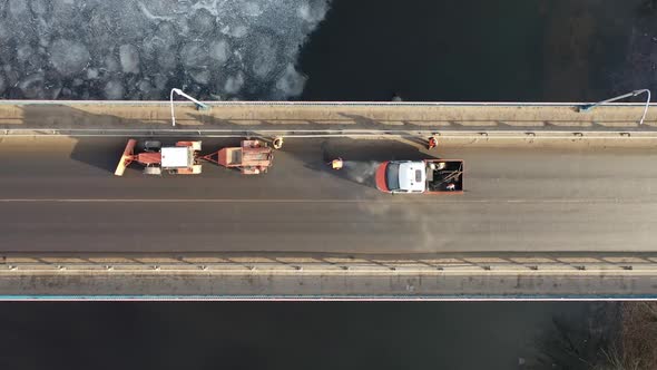 road services are repairing the bridge top view.