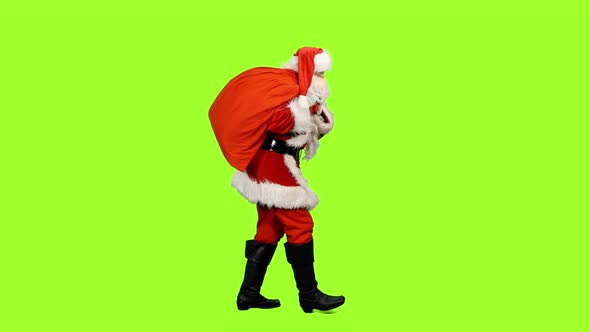 Santa Claus Carrying Christmas Gifts on Green Background
