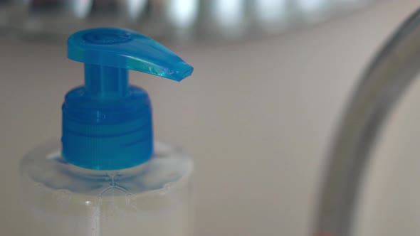 Pressing Dispenser with Liquid Soap Close Up