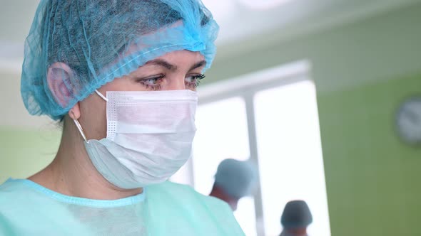 Surgeon's Assistant Prepares Tools for Surgery