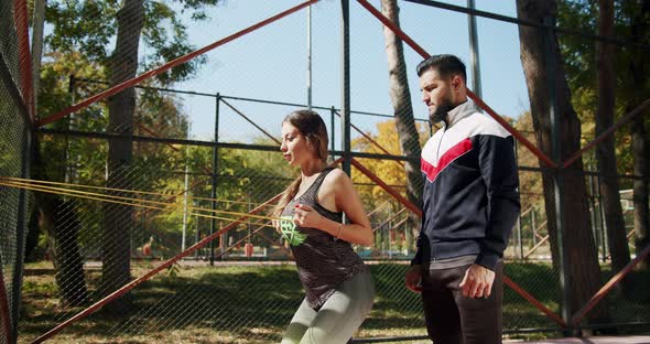 Outdoor Training with Personal Trainer with Elastic Band alt
