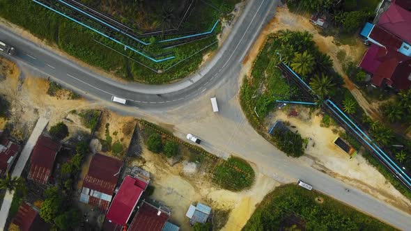 Cinematic Drone Footage of white Mazda Light Vehicle sequences in the middle of the jungle surrounde alt