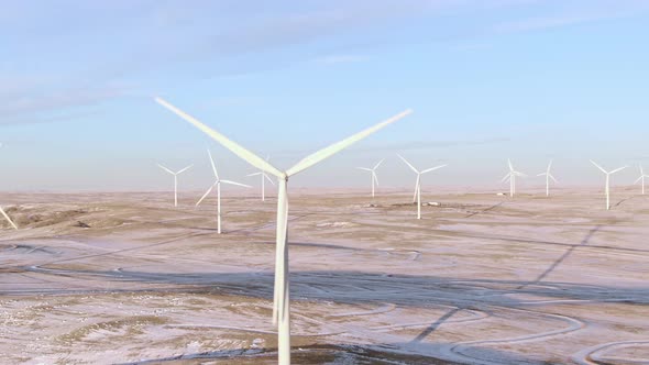 Aerial shots of wind turbines on a cold winter afternoon in Calhan, Colorado alt