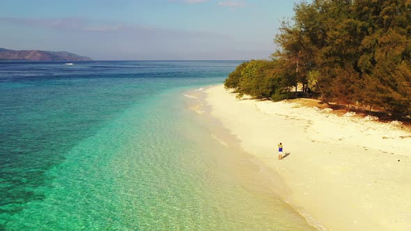 Natural drone tourism shot of a sandy white paradise beach and aqua turquoise water background alt