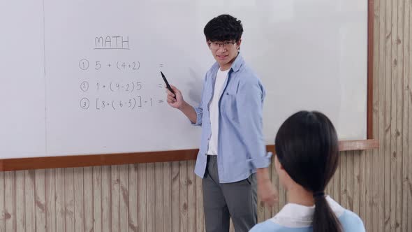 Teacher is teaching in the classroom alt