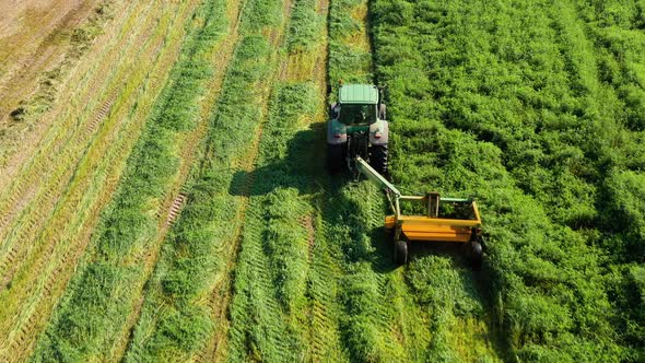 Tractor with a Mechanized Disc Mower alt