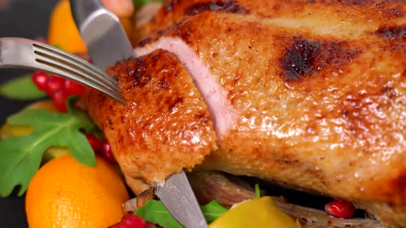 Slicing roasted Peking Duck. Roasted Chicken Dinner. Holiday table. Roast chicken alt