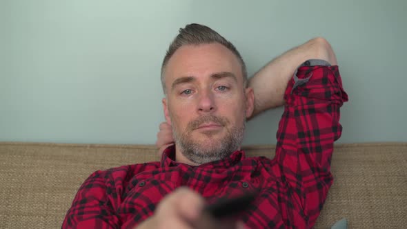 A Very Bored Man Changing Channels alt