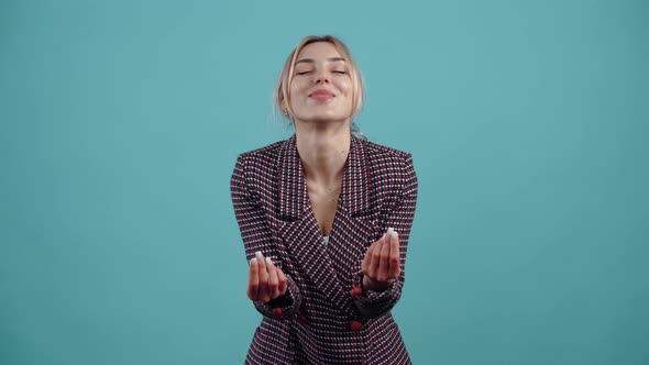 The Optimistic Blonde Rubs Her Fingers Being Pleasantly Surprised By Her Financial Situation alt