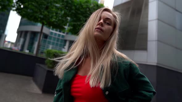 Young Slim Woman Is Wearing Casual Street Style Clothes Is Walking in Modern City alt