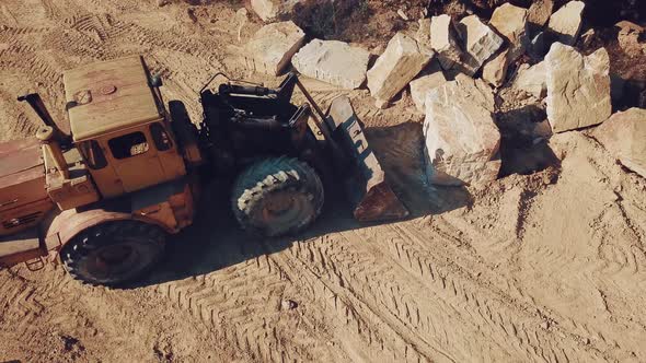 Specially Equipped Bulldozer With a Jug is Picking Stone alt