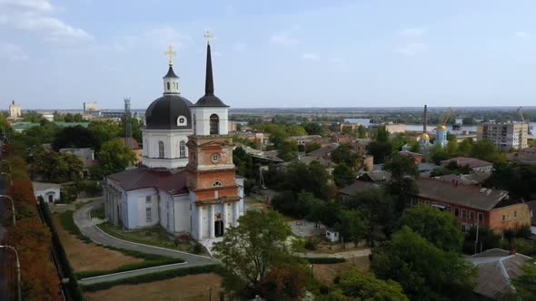 Aerial Drone Footage of Cherson City Church and Houses with Green Trees Ukraine