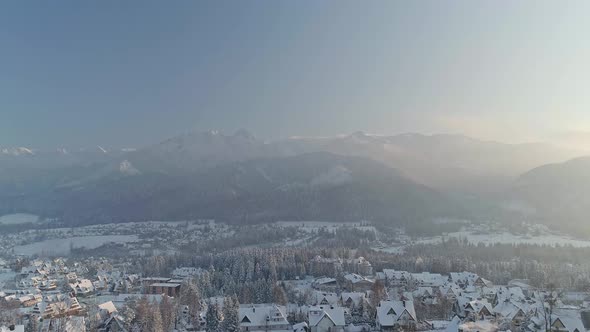 Winter Landscape At The Zakopane Town Near Mountains In Poland. - aerial alt