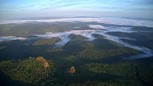 Top View of the Mountains in the Fog in the Russian Nature Reserve Stolby