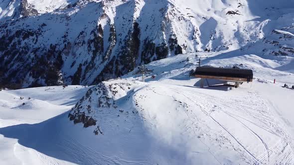 Aerial View of the Alps Mountains in France. Mountain Tops Covered in Snow. Alpine Ski Facilities