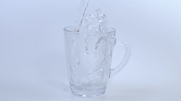 Pouring Fresh Water into Glass. 1000 fps. alt