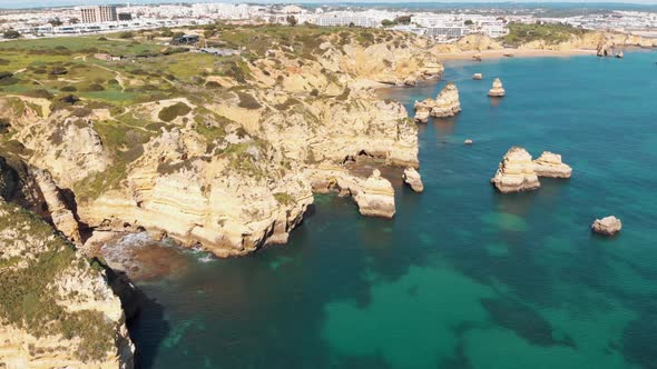 Coves and grottos in the eroded Cliffs of Lagos shoreline, Algarve, Portugal alt