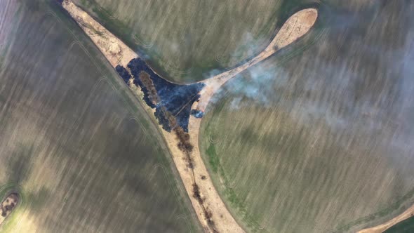 Bartinney Nature Reserve Grass fire. Drone Fly over Wild fire. Flying above burnt field. alt