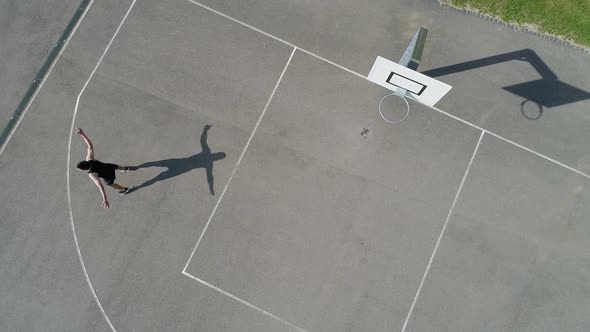 Man and woman shooting basketball on the court