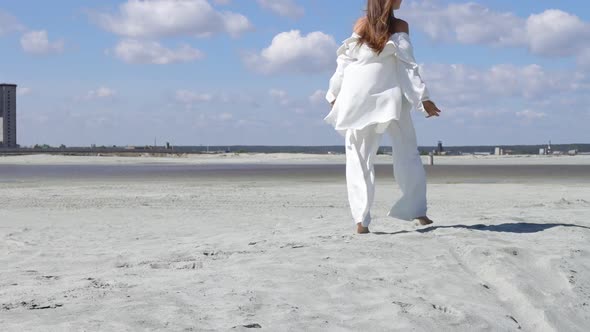 Beautiful Woman Walking on Shore