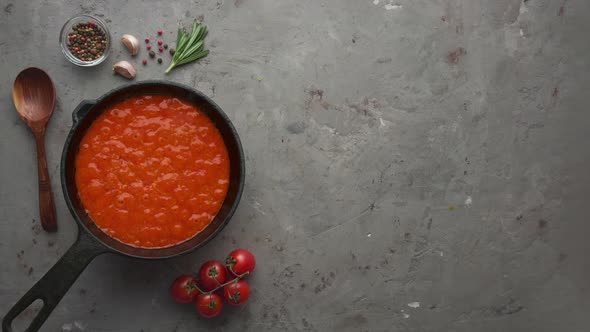 Cinemagraph loop. Bubbling hot tomato sauce for pasta, cooking in pan