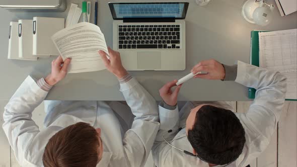 Top View of Discussion About New Pills Between Doctors alt