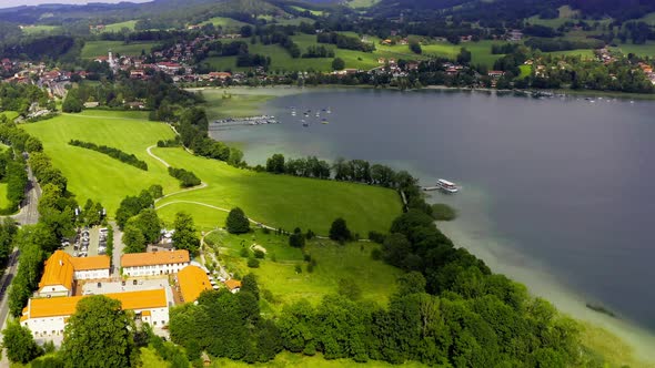 Beautiful bavarian Tegernsee - Aerial view of a moored ship at Gmund and the restaurant Gut Kaltenbr alt