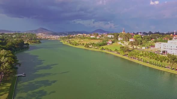 Panoramic View Lake with Forest and Modern City alt