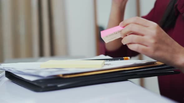 Close up woman hand doing document at home