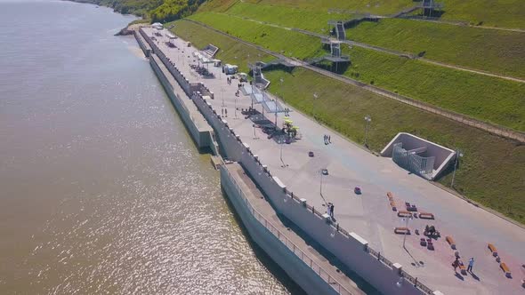 Newly Wedded Couple Walks Along Embankment Bird Eye View alt