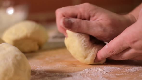 Baker is stirring yeast dough alt