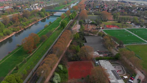 Top view of the embankment of the Neckar River. Bridges, green grass and trees. alt