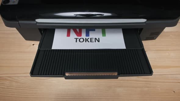 NFT Token Printing Inscription on White Sheet of Paper Printed By a Jet Printer alt