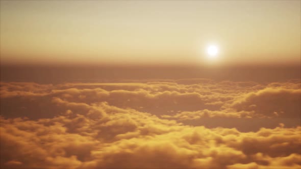 Flight through clouds in evening or morning