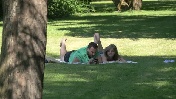 Couple lying on grass 