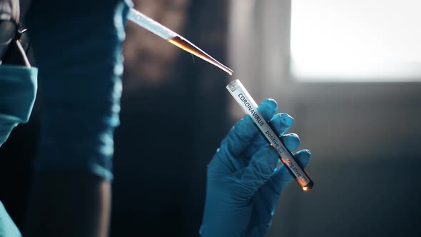 Doctor taking samples from coronavirus COVID-19 test tube