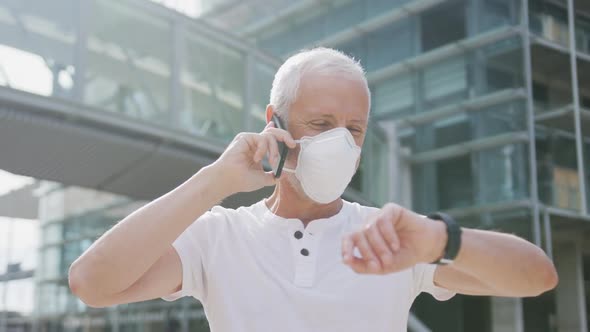 Caucasian man out and about in the street wearing on a face mask against coronavirus alt