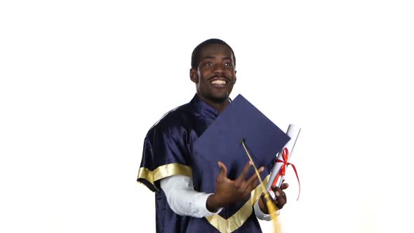 Graduate with a Diploma and the Academic Hat. White alt