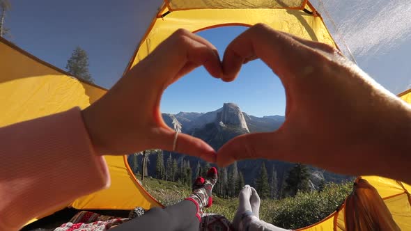 A Hand Heart Against the Background of the Picturesque View of Half Dome Cliff. Yosemite Valley, USA alt