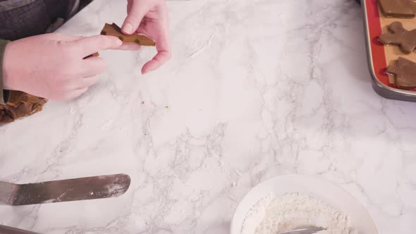 Step by step. Cutting out shapes with Christmas cookies cutter from gingerbread cookie dough. alt